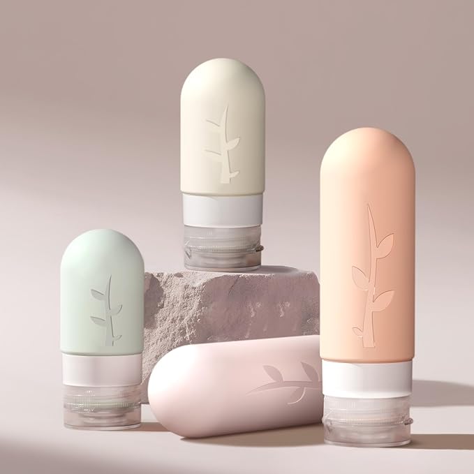 Travel Bottles Kit (16 Pack) - TSA Approved, Leak Proof Silicone Squeezable Containers for Toiletries. Complete Set with Jars, Sprayers & Bag (Pink)