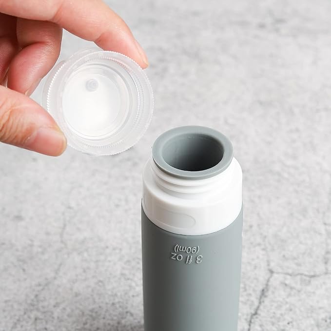 Travel Bottles Kit (16 Pack) - TSA Approved, Leak Proof Silicone Squeezable Containers for Toiletries. Complete Set with Jars, Sprayers & Bag (Black)