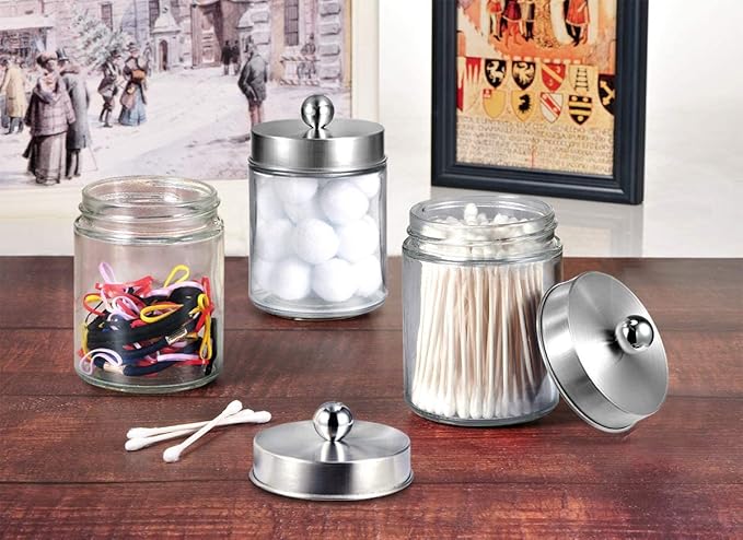 Amolliar 4 Pc Glass Apothecary Jars - Countertop Qtip Dispenser Holder with Stainless Steel Lids&Cute Stickers -Bathroom Vanity Storage Organizer Set for Qtips,Cotton Swabs/Rounds (Brushed Nickel)