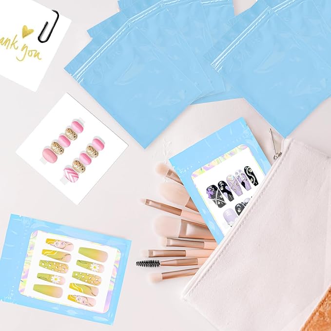 100PCS Empty Solid Blue Holographic Nail Storage Bag Press on Nail Packaging Bag and 100PCS Shiny white cardboard Nail Tips Packaging Bags with 1 Roll Transparent Tape
