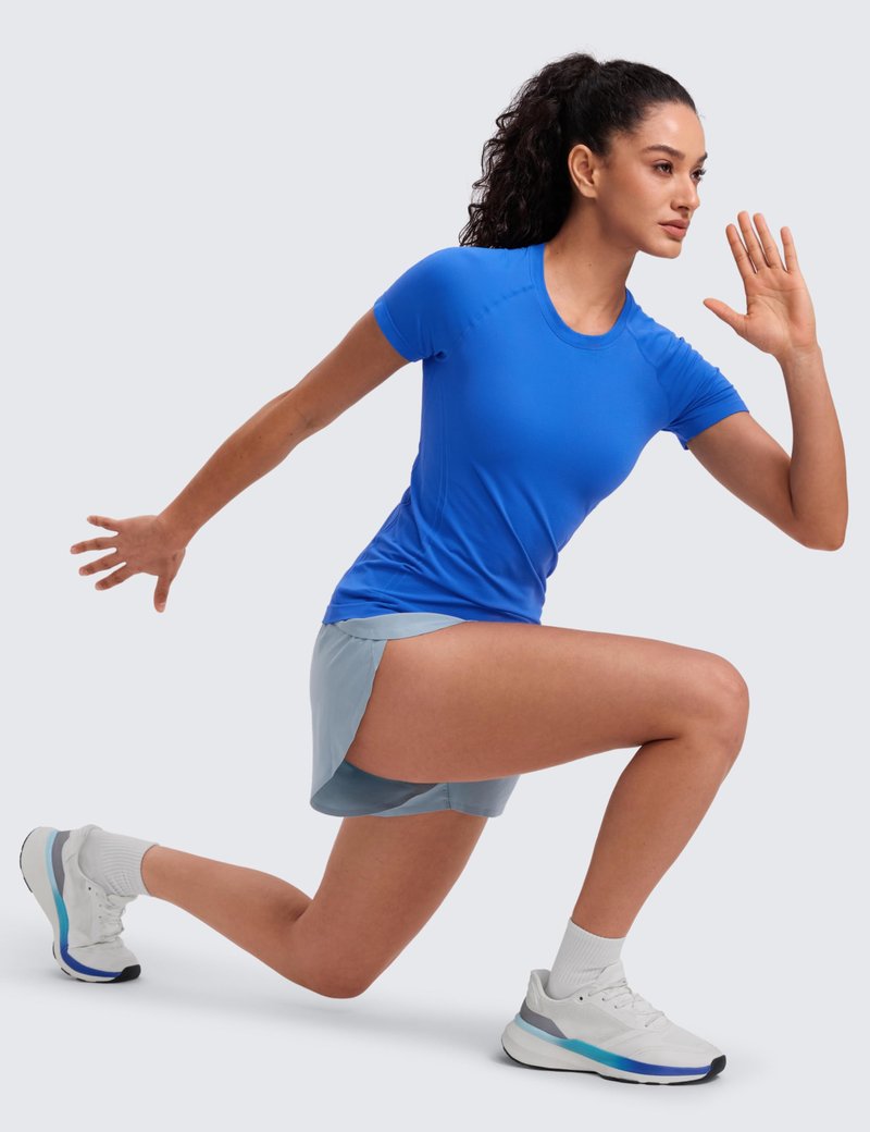 CRZ YOGA Seamless Workout Tops for Women Hip Length - Athletic Running Gym Yoga Short Sleeve Shirts Breathable Crewneck Tees Sparkle Blue XX-Small