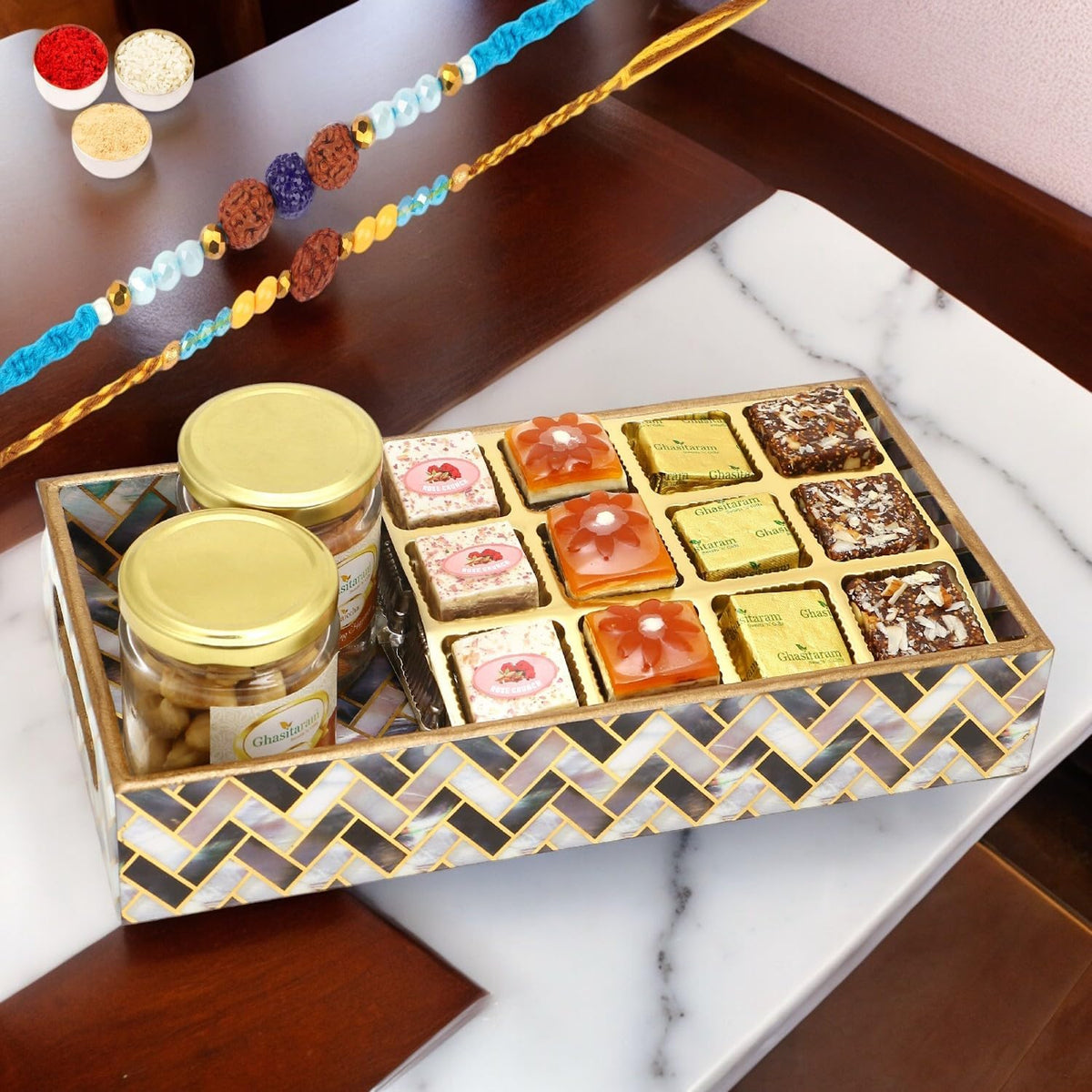 Ghasitaram Gifts Rakhi Gifts for Brothers Printed Blue Tray of Assorted Bites, Roasted Cashews and Almonds Jars with 2 Blue Rudraksh Rakhis