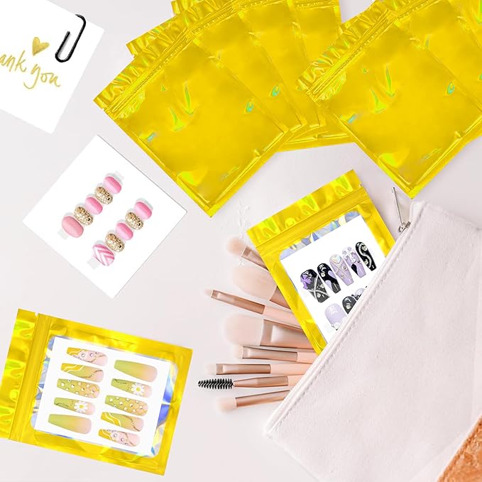 Qenk 100PCS Empty Holographic Nail Storage Bag Press on Nail Packaging Bag and 100PCS Shiny white cardboard Nail Tips Packaging Bags with 1 Roll Transparent Tape (Gold)