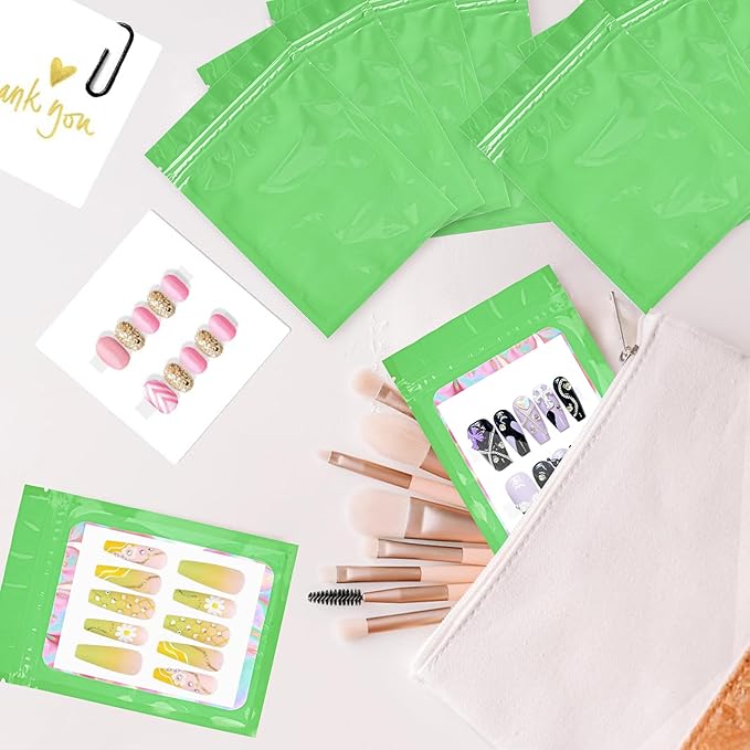 100PCS Empty Solid Green Holographic Nail Storage Bag Press on Nail Packaging Bag and 100PCS Shiny white cardboard Nail Tips Packaging Bags with 1 Roll Transparent Tape