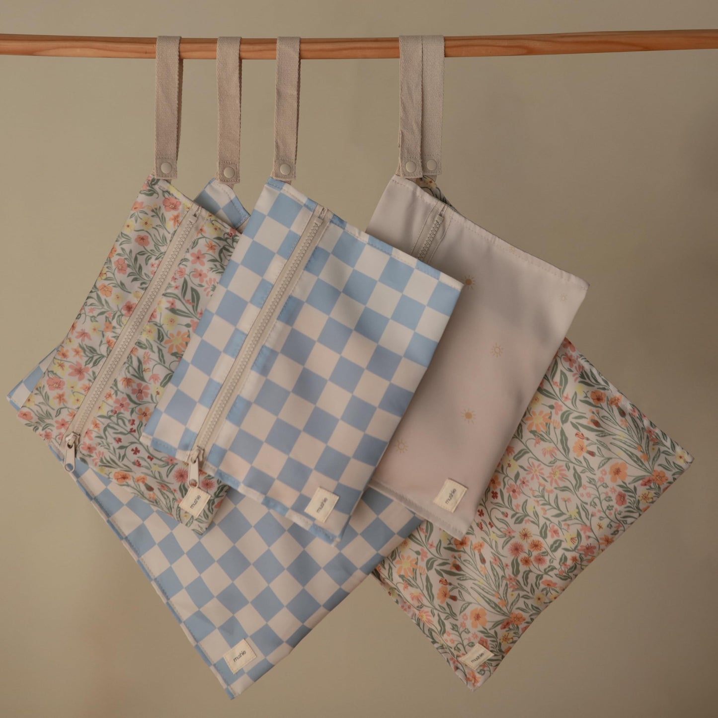 mushie Water Resistant Wet Bags | Large & Small Reusable Storage Bag for Baby Items and Travel | Zippered Pockets with Handle | Machine Washable, Set of 2 (Pastel Blooms)