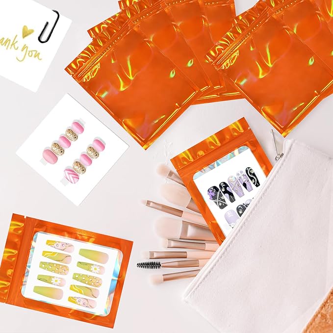 Qenk 100PCS Empty Holographic Nail Storage Bag Press on Nail Packaging Bag and 100PCS Shiny white cardboard Nail Tips Packaging Bags with 1 Roll Transparent Tape (Orange)